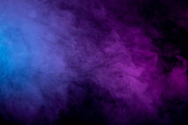 Pattern, Neon purple    and   blue smoke in the  on a dark isolated background. Background from the smoke of vape