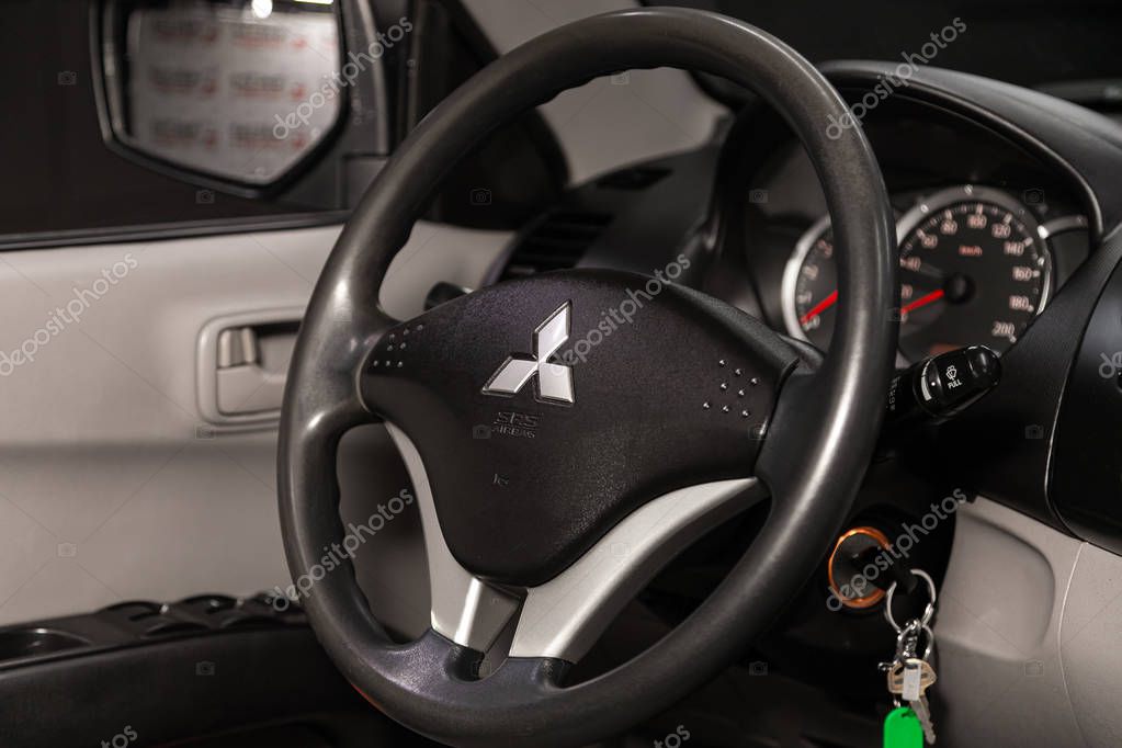 Novosibirsk, Russia  December 18, 2019:  Mitsubishi L200,  dashboard, player, steering wheel with logo and buttons, speedometer and tachometer