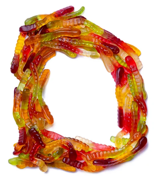 Food pattern made ffrom children's sweets snakes — Stock Photo, Image