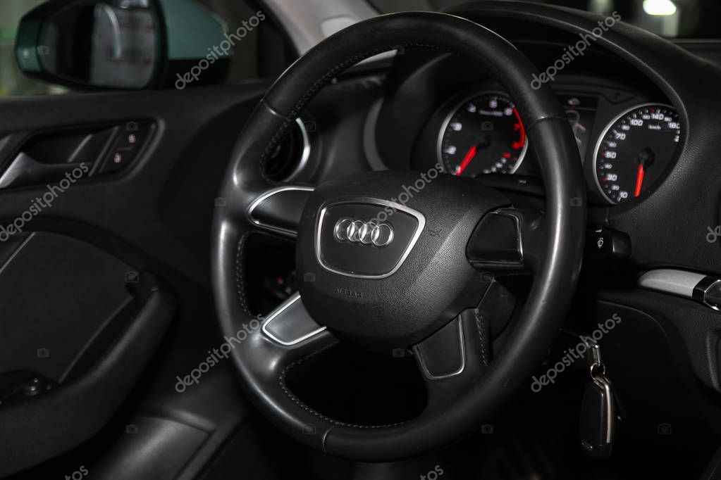 Novosibirsk, Russia   February 12, 2020:  Audi A3, dashboard, player, steering wheel with logo and buttons, speedometer and tachometer