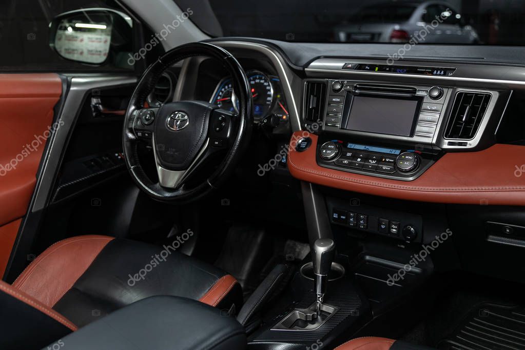 Novosibirsk, Russia   November 13, 2019:  Toyota RAV-4, Salon of a new stylish car, view from the passenger side. Auto interior: driver's seat in beige leather, control panel with plastic under a tree