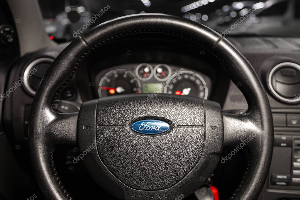 Novosibirsk, Russia   January 14, 2020:  Ford  Fusion, dashboard, player, steering wheel with logo and buttons, speedometer and tachometer
