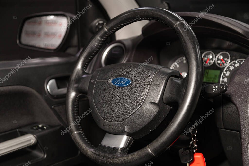 Novosibirsk, Russia   January 14, 2020:  Ford  Fusion, dashboard, player, steering wheel with logo and buttons, speedometer and tachometer