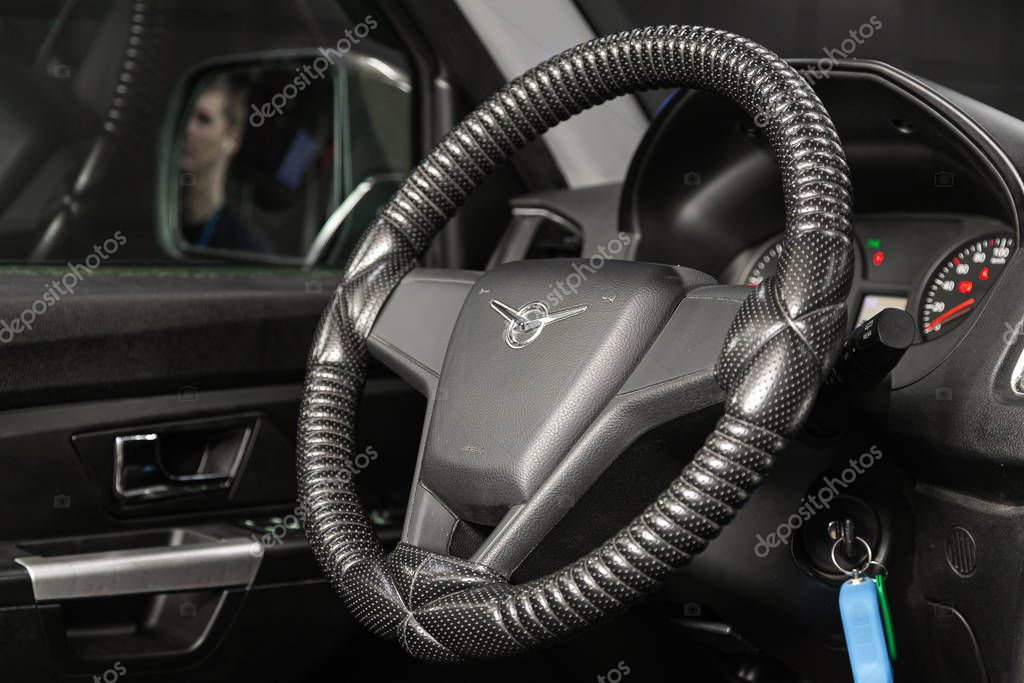 Novosibirsk, Russia   January 14, 2020:  UAZ Patriot , dashboard, player, steering wheel with logo and buttons, speedometer and tachometer