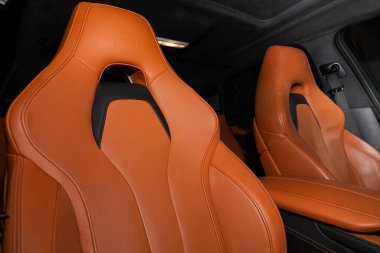 Novosibirsk, Russia  February 12, 2020: BMW X6, close-up  orange headrest driver's seat made of genuine leather with  logo  
