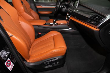 Novosibirsk, Russia  February 12, 2020: BMW X6, Salon of a new stylish car, view from the outside. Auto interior: driver's seat in beige leather