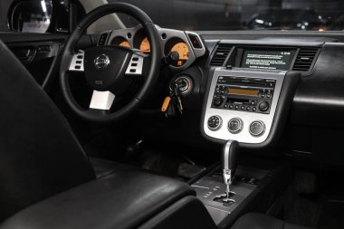 Novosibirsk, Russia  January 05, 2020:  Nissan Murano, Salon of a new stylish car, view from the passenger side. Auto interior: driver's seat in beige leather