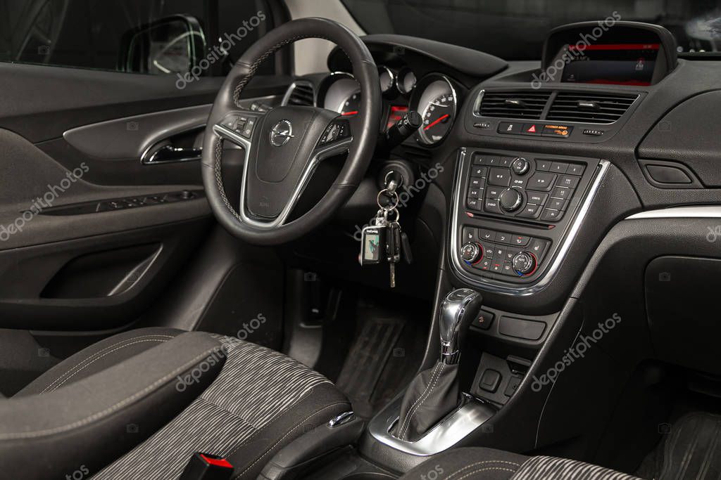 Novosibirsk, Russia  January 11, 2020:   Opel Mokka, Salon of a new stylish car, view from the passenger side. Auto interior: driver's seat in beige leather