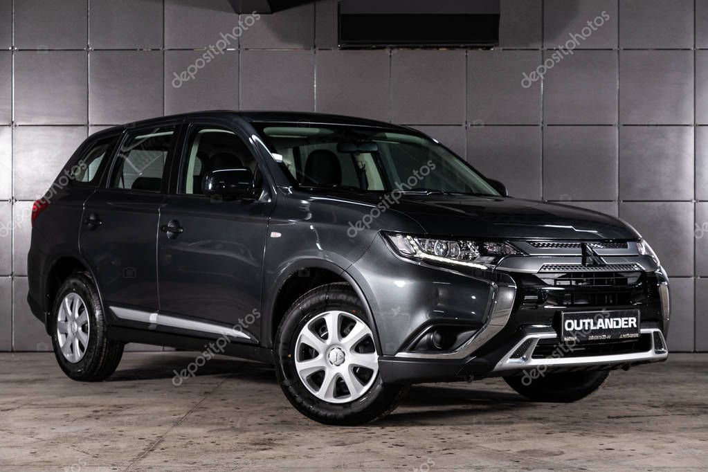 Novosibirsk, Russia  February 10, 2020:  gray Mitsubishi Outlander, front view.  Photography of a modern crossover made in Japan on a parking in Novosibirsk