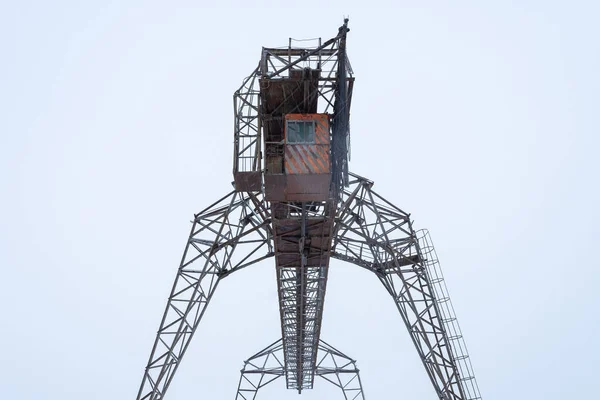 Large metal gantry cranes at a construction site against the blue sky. Type of bearing metal structures of gantry crane  for loading goods