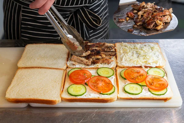 Close Male Chef Black Apron Lays Out Pieces Meat Cheese — Stock Photo, Image