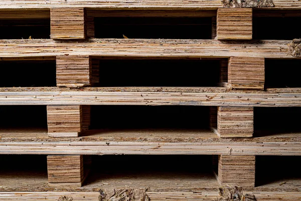 Close-up of wooden shelving for storing goods. Industrial pallets for transportation