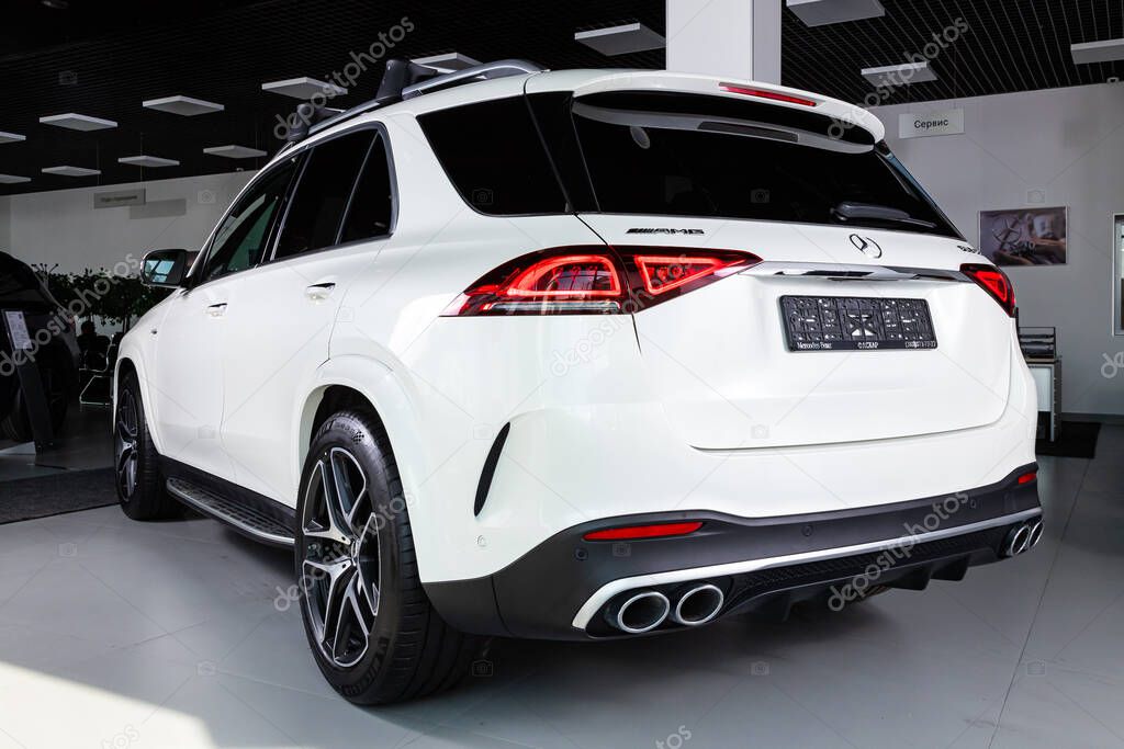 Novosibirsk/ Russia  April 06, 2020:  Mercedes-Benz GLE mid-range luxury SUV, back view. New expensive  modern  sedan  on a parking on  white background