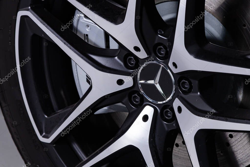 Novosibirsk/ Russia  April 06, 2020:  Car wheel with alloy wheel, logo Mersedes and new rubber on a car closeup. Wheel tuning disk