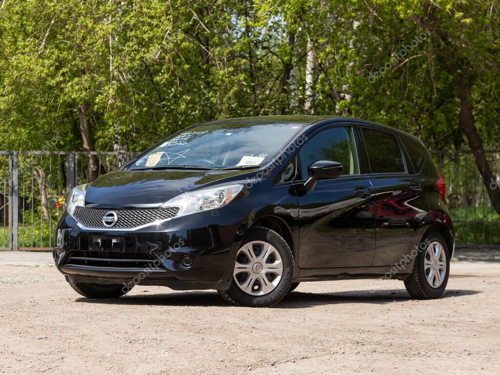 Novosibirsk/ Russia  May 03 2020: black Nissan Note,  front view.  Modern hatchback made in Japan on a parking in Novosibirsk