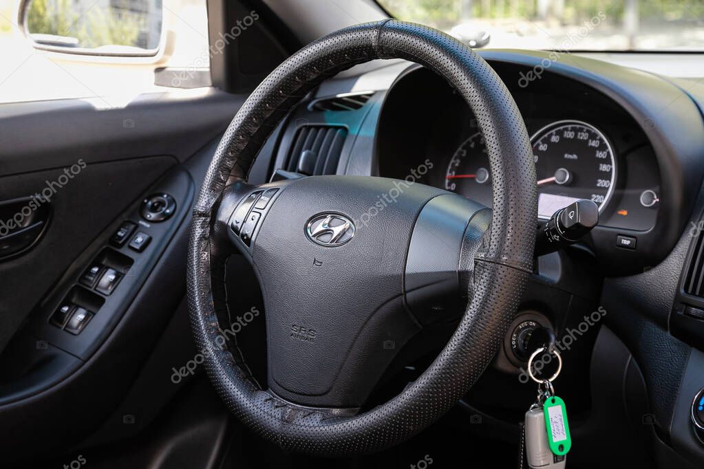 Novosibirsk/ Russia  May 03 2020: Hyundai Elantra, Auto interior: steering wheel with red logo  and  speedometer and tachometer