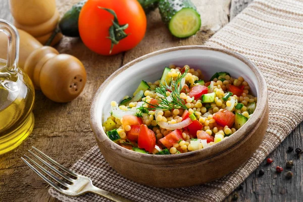 Israeli couscous Ptitim with vegetables Stock Image