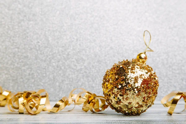 Christmas golden ball with gold ribbon