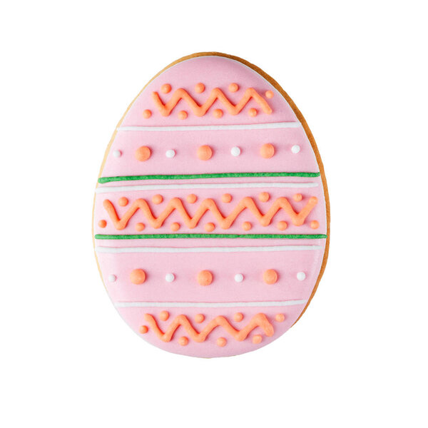 Easter homemade painted gingerbread isolated on white background. Yellow colorful cookie in shape of egg with ornament