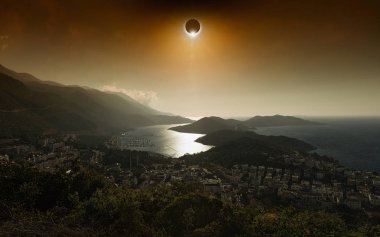 Total solar eclipse in dark red glowing sky above seaside city clipart