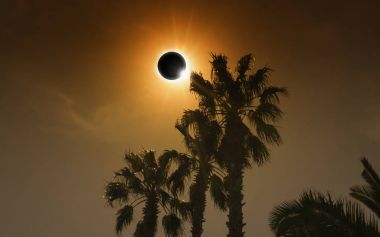 Total solar eclipse in dark glowing sky clipart