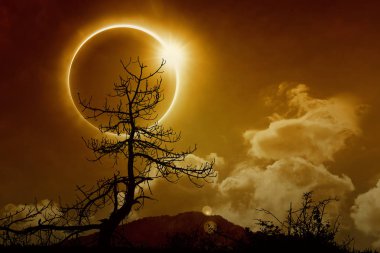 Total solar eclipse in dark glowing sky clipart