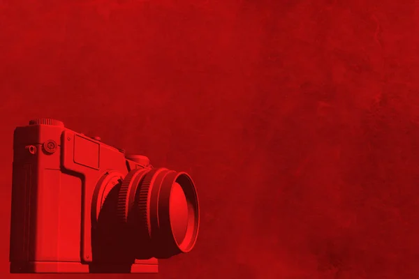 red camera on red background