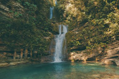 waterfall in surreal architecture, fantastic landscape, beautiful old castle, beautiful structures, jungle and waterfalls in the surreal botanical garden of Edward James, Xilitla, San Luis Potosí, Mex