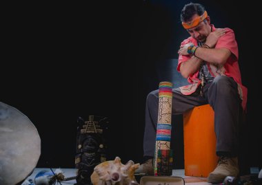 Shaman man, sorcerer, giving thanks duringPre-Hispanic ritual in