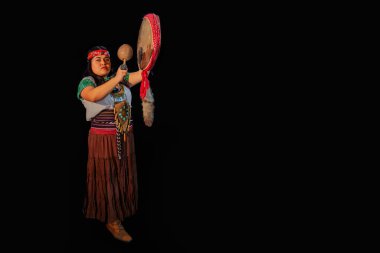 young woman Shaman ,with sahumerio in the hands , curandera, Olmec facilitator, Teotihuacana, Xicalanca - Toltec in black background, with pre-Hispanic dress,mystical smoke environment