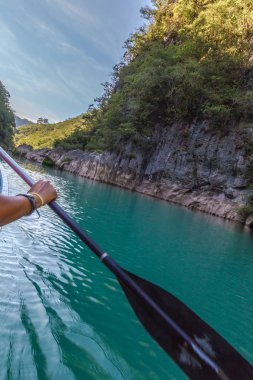 Amazing crystalline blue water of Tamul waterfall, Close up view of spectacular Tamul River,at Huasteca Potosina in San Luis Potosi, Mexico