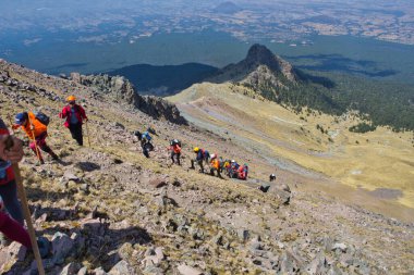 Tlaxcala, Puebla, Mexico, March 2, 2020: group of mountaineers ascending to the chasm of the malinche volcano