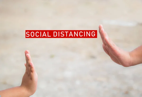 Social distancing and non-contact greetings. Two young children\'s hands reaching out to touch each other. Concept of public health.