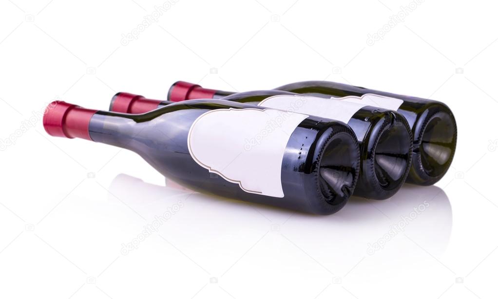 Three bottles of wine lying on the bright side — Stock Photo © bborriss