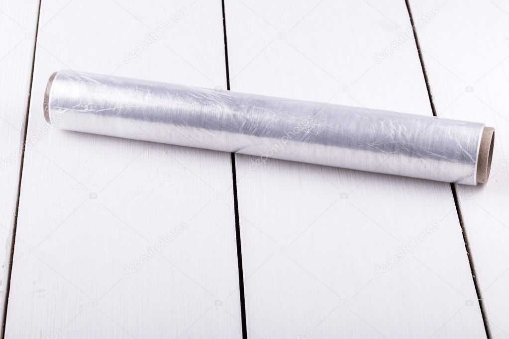 roll of plastic stretch film on white