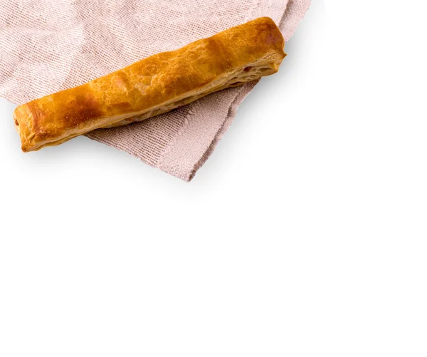 Puff pastry with a rough pink tablecloth — Stock Photo, Image