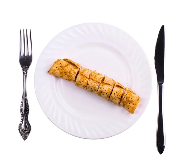 Delicious pancake liver cut into pieces on a white plate — Stock Photo, Image