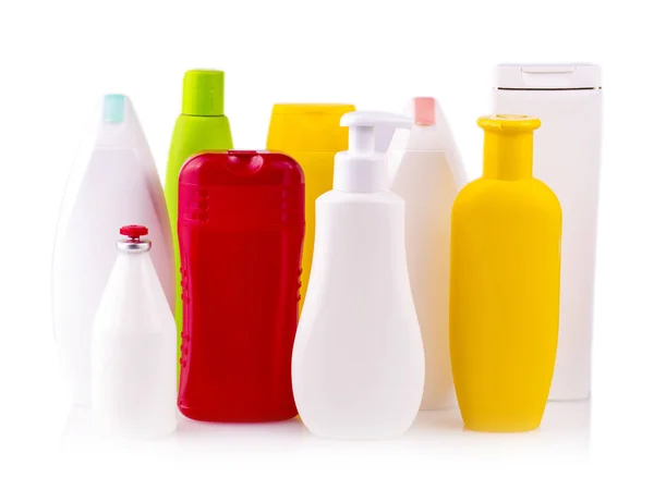 Close up of a white and colored bottles — Stock Photo, Image