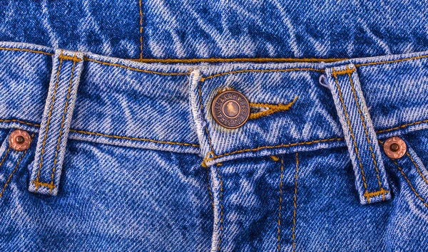 Close up of the LEVI'S button on the blue jeans — Stock Photo, Image