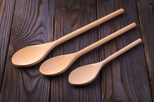 Wood spoons on wooden table