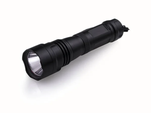 Black  police flashlight isolated on white background. Stock Photo