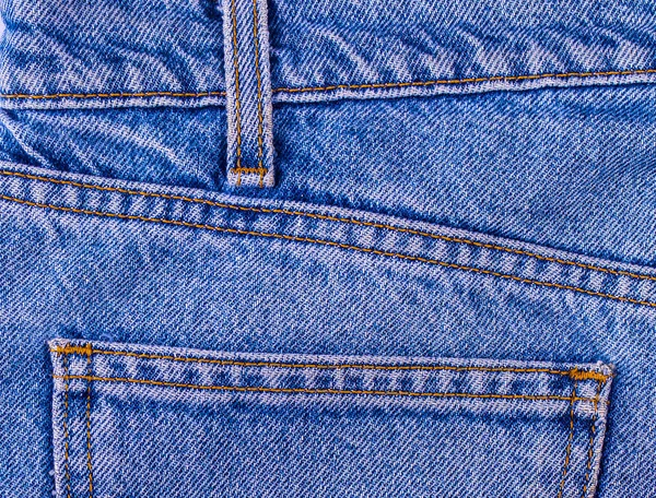 Denim azul jean bolsillo textura es el clásico de la moda índigo —  Fotos de Stock
