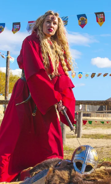Woman in red medieval clothes on nature — Stock Photo, Image