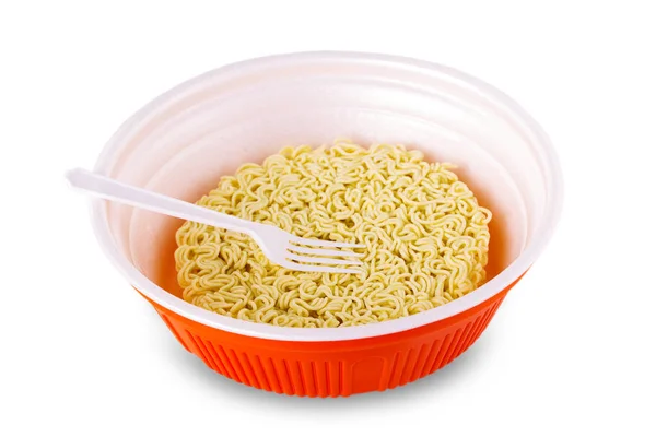 Instant noodle in cup with plastic fork on white background. — Stock Photo, Image