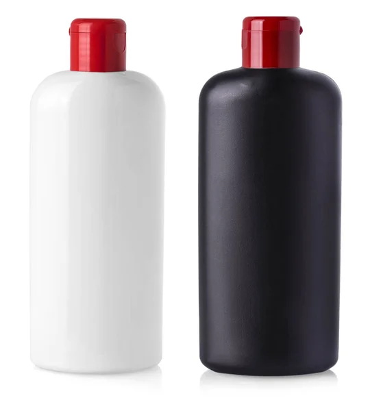Schwarze und weiße leere Plastikflaschen auf isoliertem Hintergrund. — Stockfoto