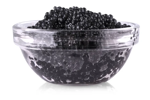 Caviar noir dans un bol en verre sur fond blanc . — Photo