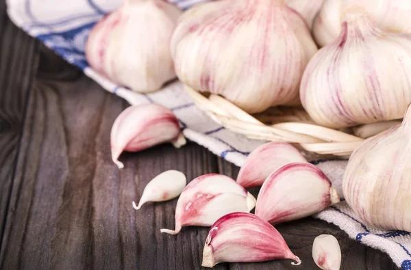 Garlic Cloves and Garlic Bulb on kitchen towel