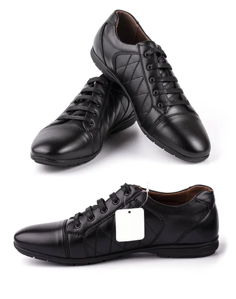 Чорний шкіряний черевик з етикеткою на білому — стокове фото