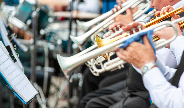 Selective focus.  Musicians playing in outerwear on the street