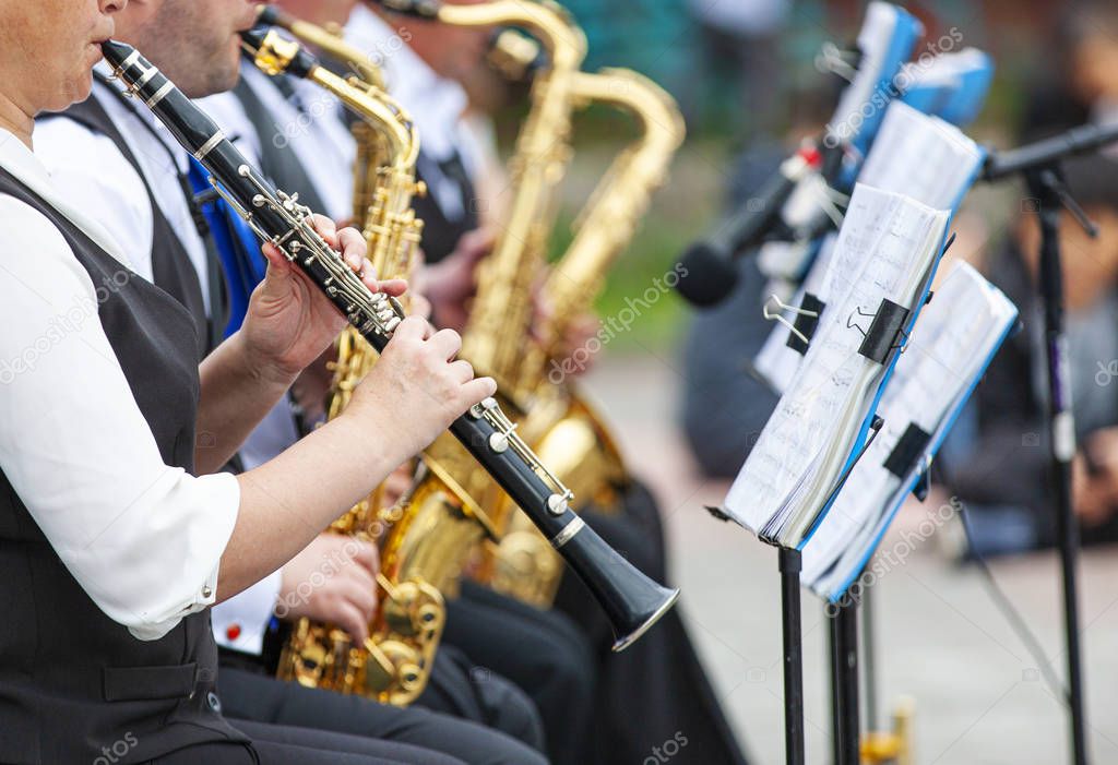 Selective focus.  Musicians playing in outerwear on the street